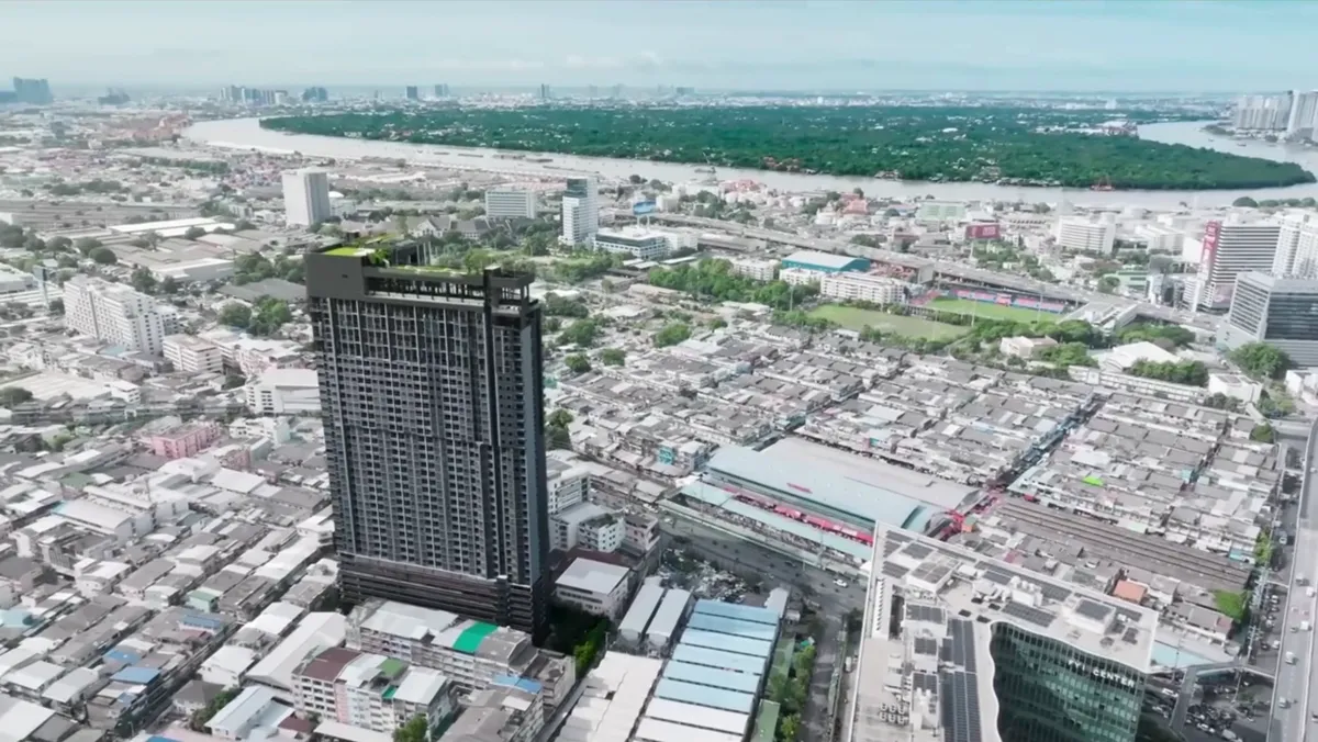 The LIFE Rama 4 - Asoke tower beside the river and the city.