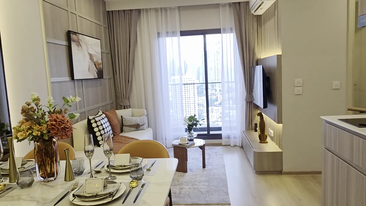 A residence dining table set beside a window.